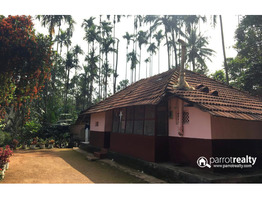 2.24 acre land with 5bhk old house for sale in Kavumannam @ 1 Cr