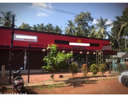 1 acre land main-road facing with commercial-building in calicut